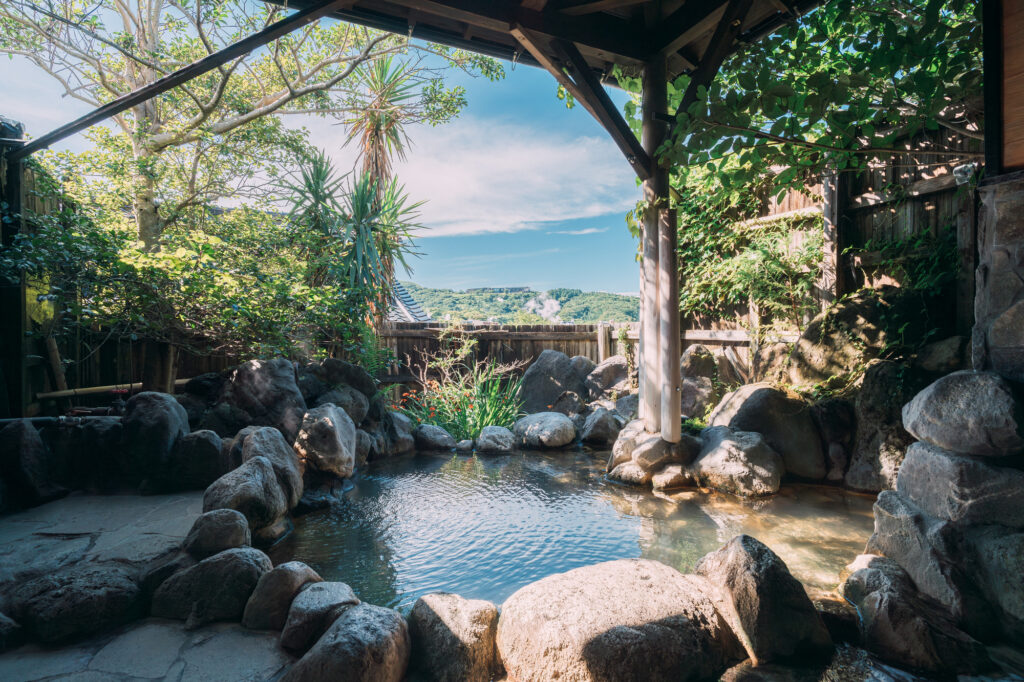 Relaxing outdoor hot spring bath (rotenburo) at Beppu Onsen in Oita, Japan - Japan Navi Journey