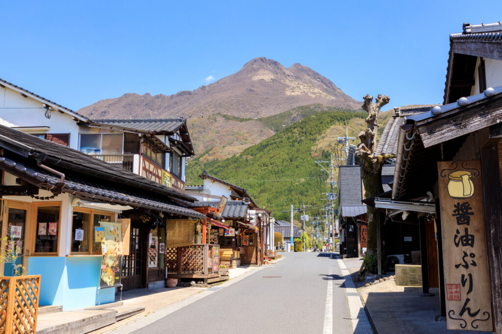 Charming traditional street lined with shops and cafes along Yunotsubo Kaido in Yufuin, Oita - Japan Navi Journey
