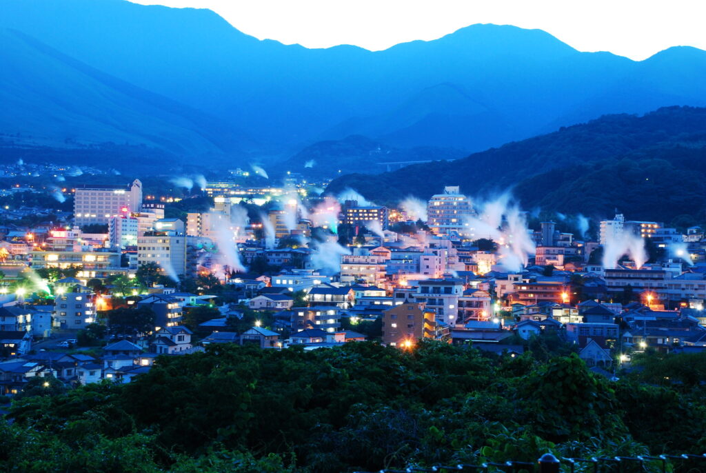 Panoramic view of hot spring steam rising across the city of Beppu, Oita - Japan Navi Journey
