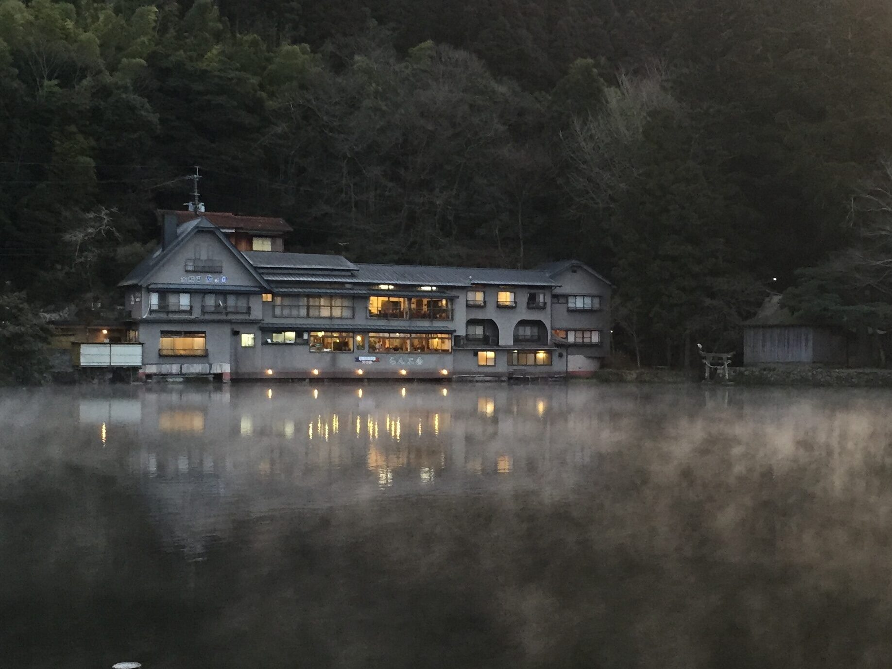 Mystical morning mist and steam rising from the calm surface of Lake Kinrin in Yufuin, Oita - Japan Navi Journey