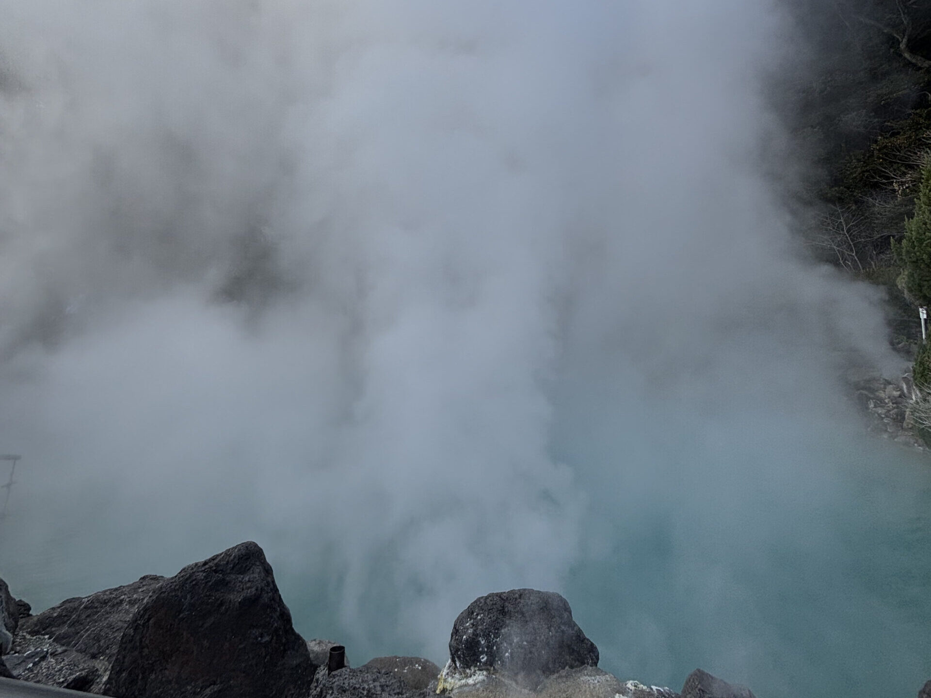 Steaming cobalt-blue hot spring pool at Umi Jigoku (Sea Hell) in Beppu, Oita - Japan Navi Journey